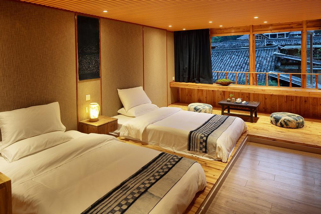 Tong Sang Art Hotel Liping Bagian luar foto