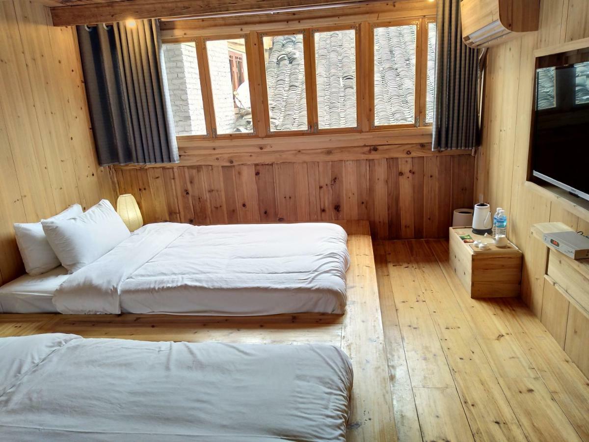 Tong Sang Art Hotel Liping Bagian luar foto